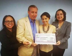 Hotelier Agnes Pierre-Louis receives Haiti's donation from (l-r) Vanessa Ledesma, Frank Comito and Karolin Troubetzkoy of the Caribbean Hotel and Tourism Association.